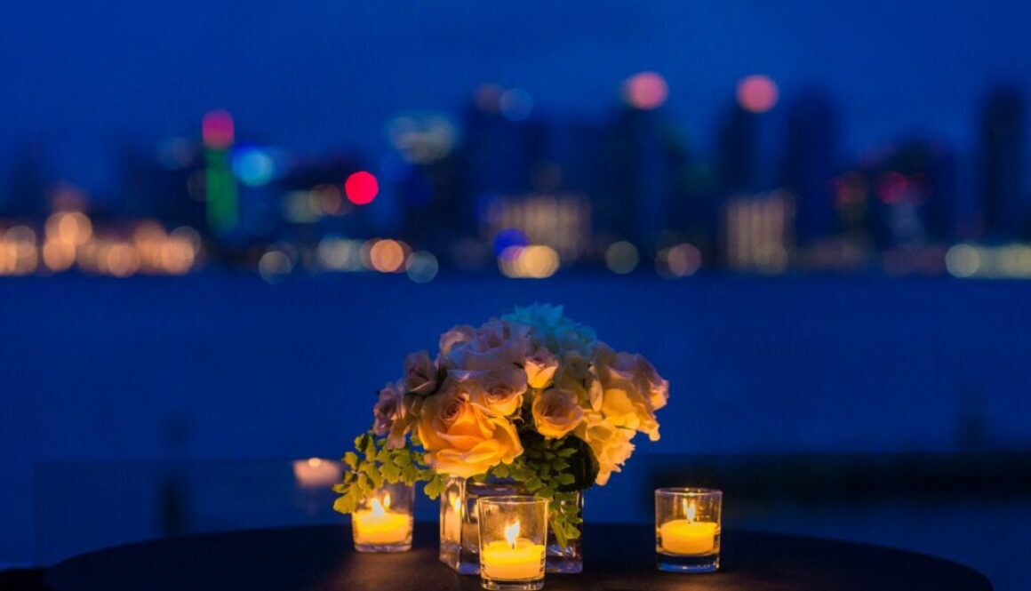 Table with candles and flowers with skyline in background