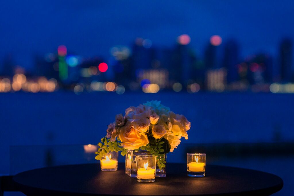 Table with candles and flowers with skyline in background