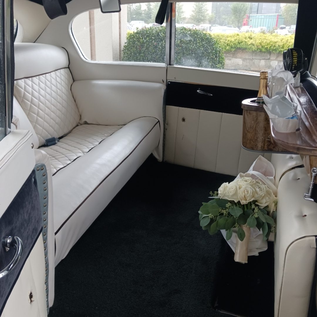 A car with a couch and a table in it